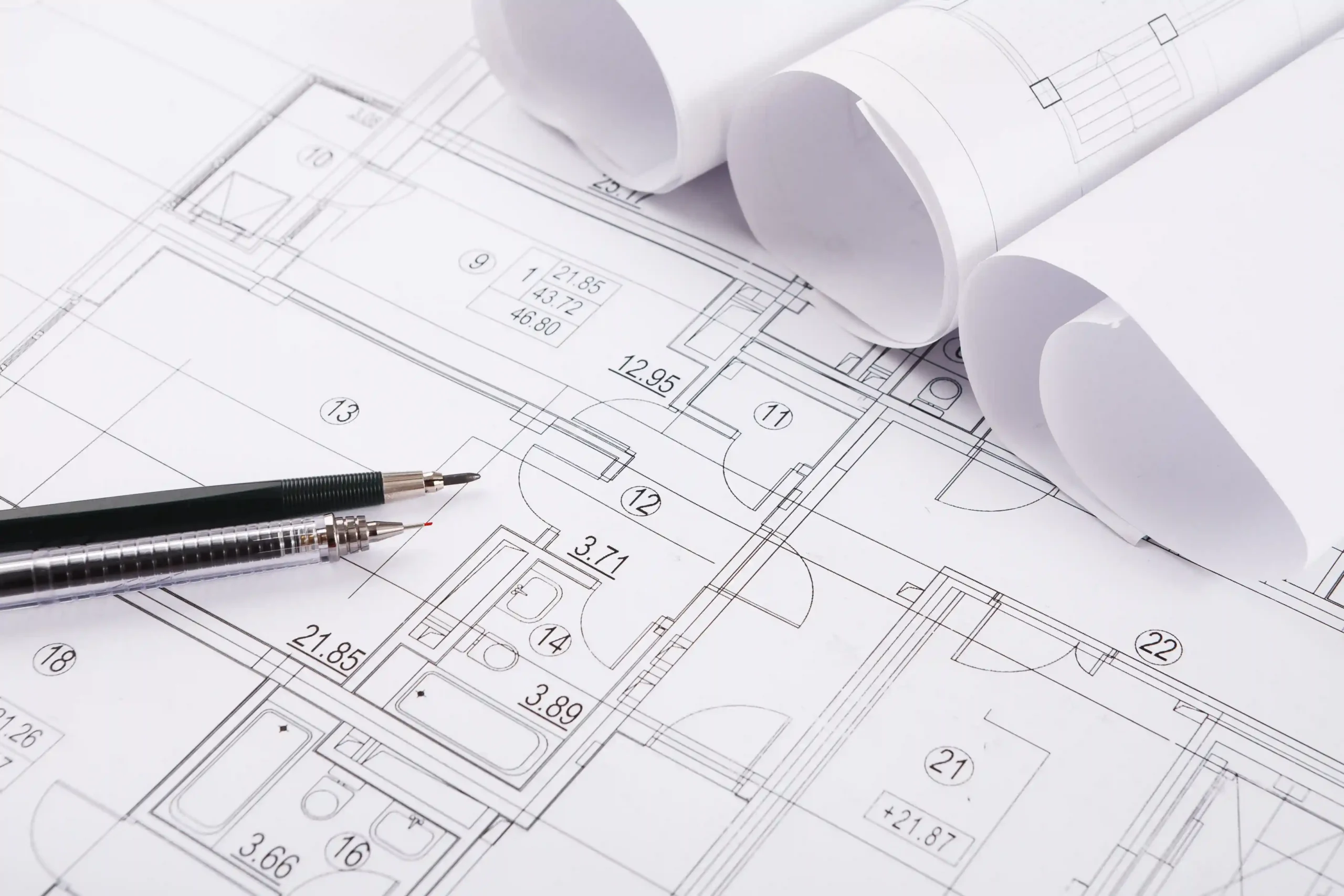Engineering blueprint drawings with architectural plans and technical design documents